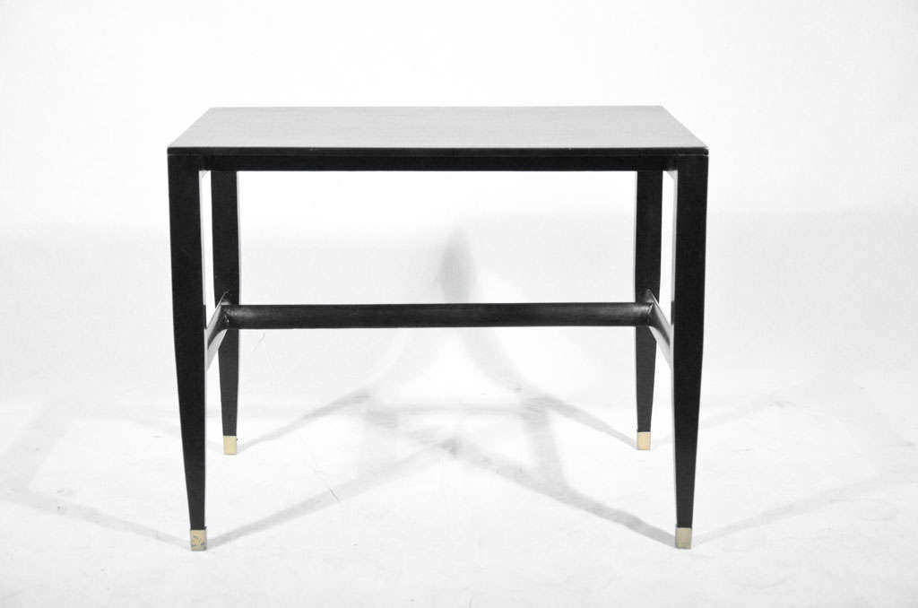 GIO PONTI  BLACK LAQUARED OCCASIONAL TABLES
Produced by Giordano Chiesa Italy, 1955 ; laquared in black by Arch.Cristina Longo in 2005
Lacquered Italian walnut, brass
Size: 25.5 w x 16.5 d x 20 h inches

Sold with a copy of a letter of