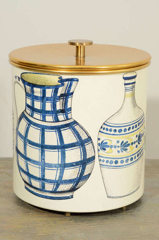 The cylindrical double walled metal bucket, decorated with ceramic jugs and vases. White label and Saks Fifth Avenue applied label.