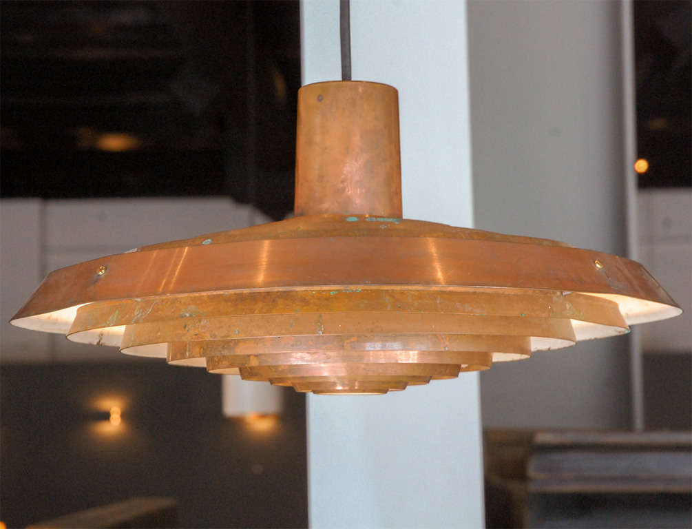 Poul Henningsen 1894-1967. Plate Lamp made of copper, designed to Langelinie Pavilion produced by Louis Poulsen. 
This model has since been discontinued. Traces of original patina. 
