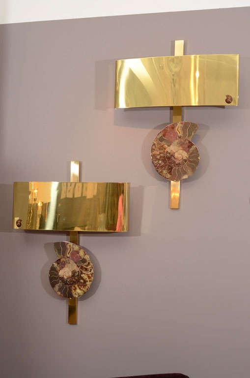 Significant wall appliques featuring large ammonite specimens on heavy brass frame. Exquisite detail of mimi-ammonite on brass shades.