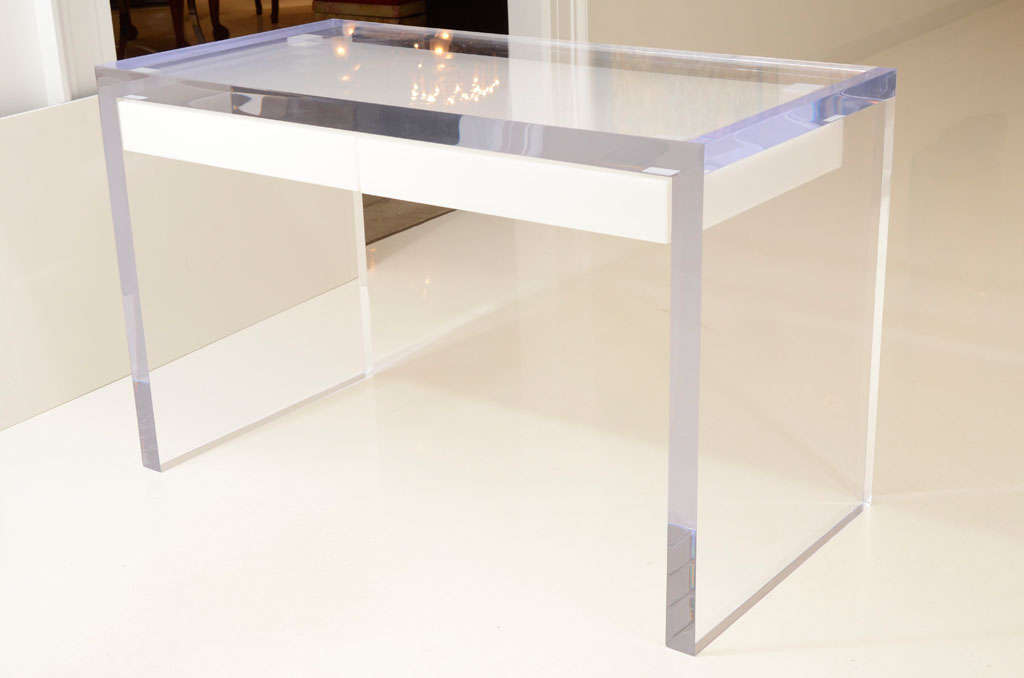Glamorous at its best, this solid and gleaming lucite desk is absolutely stunning.  Made of thick, 2