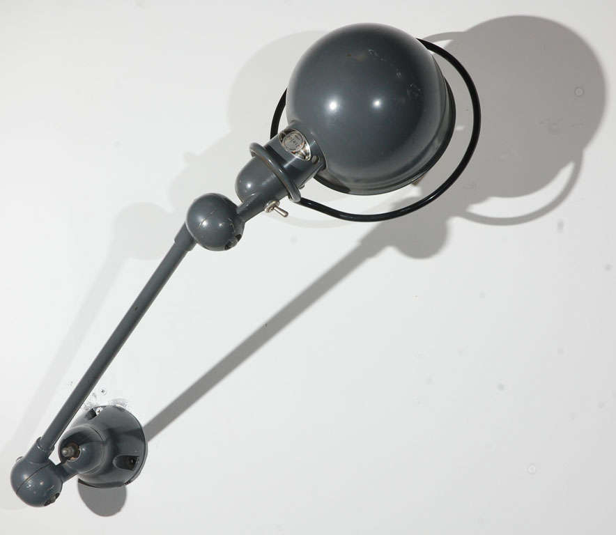 Vintage original Jielde factory industrial metal lamp made in Lyon France.
Wall-mounted articulating industrial lamps by Jean-Louis Domecq for Jielde, France, 1950s. 
With manufacturer's label.
Original Jielde task lamps with clamp holders