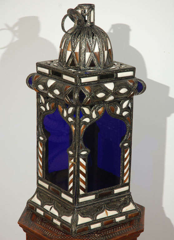Very nice craftmanship Moroccan Mosque Lamp, could be used as a table lamp or hanging light fixture. Cobalt blue hand-blown glass, Moorish arches on each side, adorned with camel bone and ebony on silver nickel filigree. Unusual luxury hand-crafted