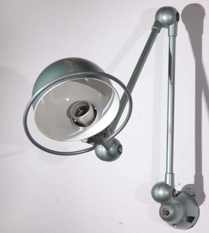 Vintage Jielde factory lamp from France, made in Lyon.
French Industrial Metal Lamp by Jean-Louis Domecq for Jielde Factory.
Circa 1940 -1950.
Original Jielde task lamps with clamp holders.
Adjustable at all joints, green plate edition, switch on