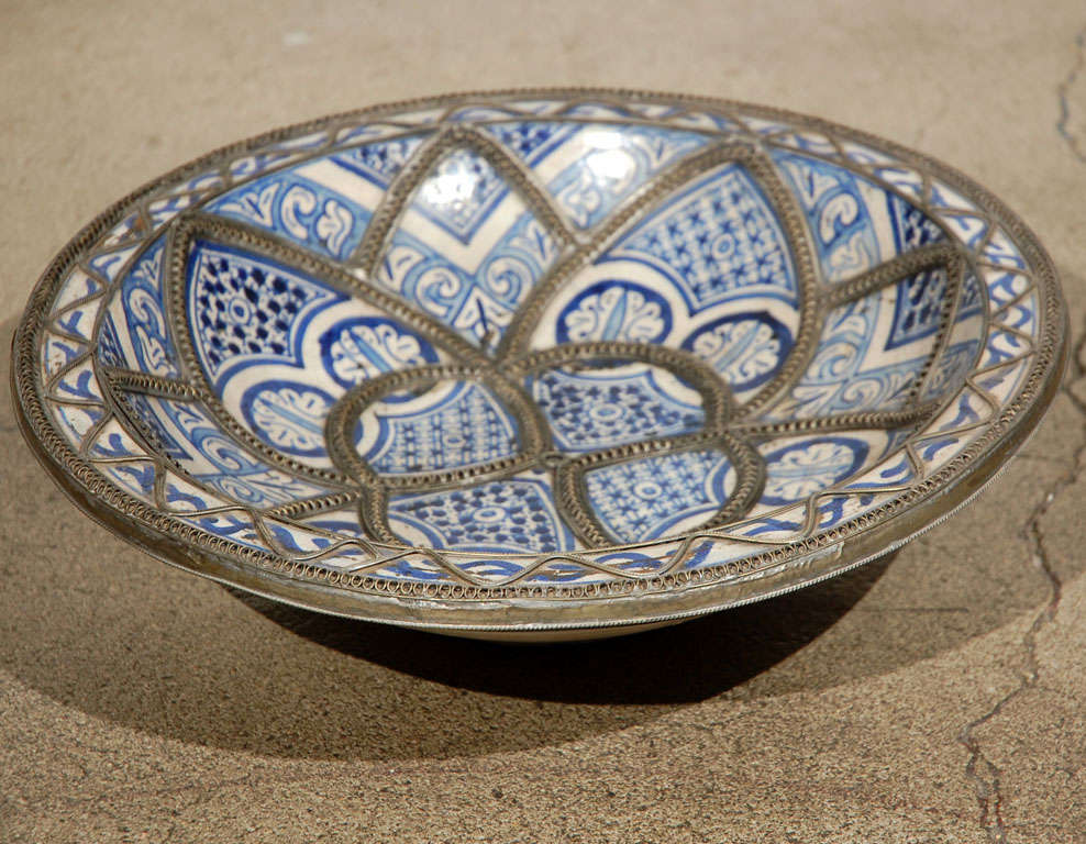 Handcrafted Moroccan ceramic plate, handmade by artisans from Fez.
Blue de Fez with white designs with nickel silver filigree designs.

 

Mosaik provides Antiques, Art Deco, Moorish Style, Spanish, African, Islamic Art, Arabian, Middle