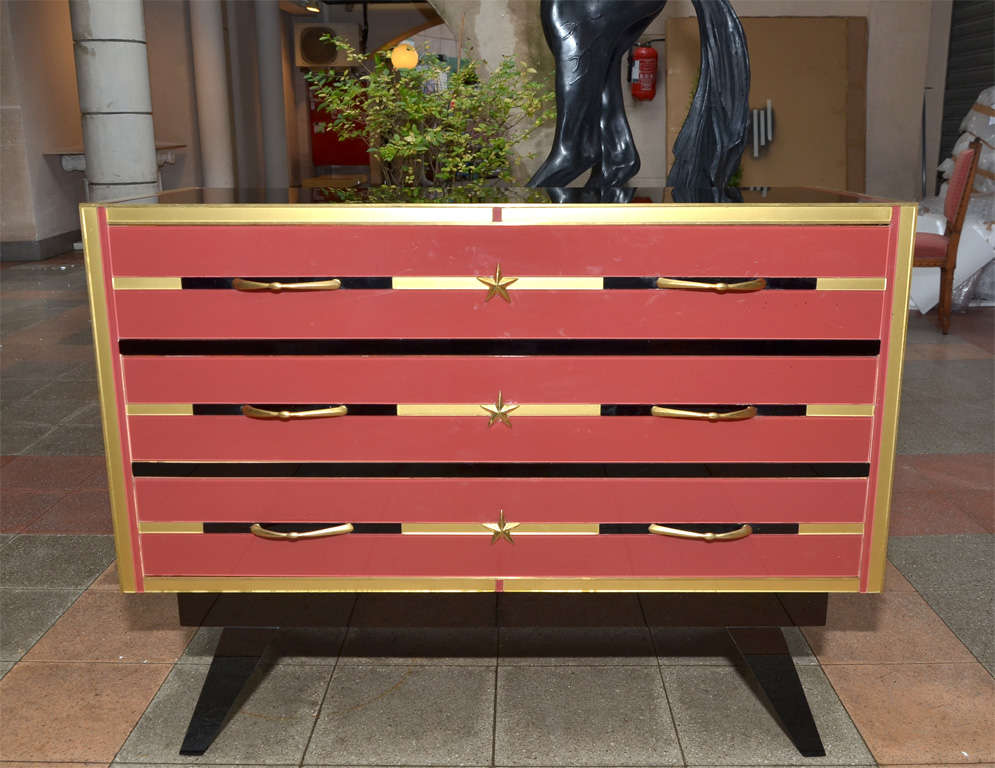 Chest of drawers in mirror.