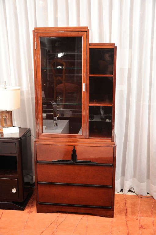 Deco skyscraper bookcase in the manor of Paul Frankl. Maple stained mahogany. Bottom drawer has a stamp of #2 from factory.
