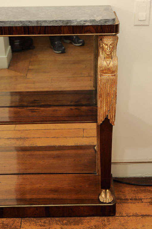 A Neoclassical Rosewood and Parcel Gilt Console with Shelf