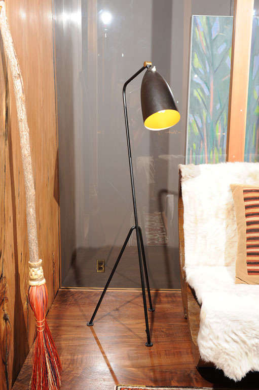 A vintage metal tripod base floor lamp painted in original black, for Bergboms, Malmo, Sweden.