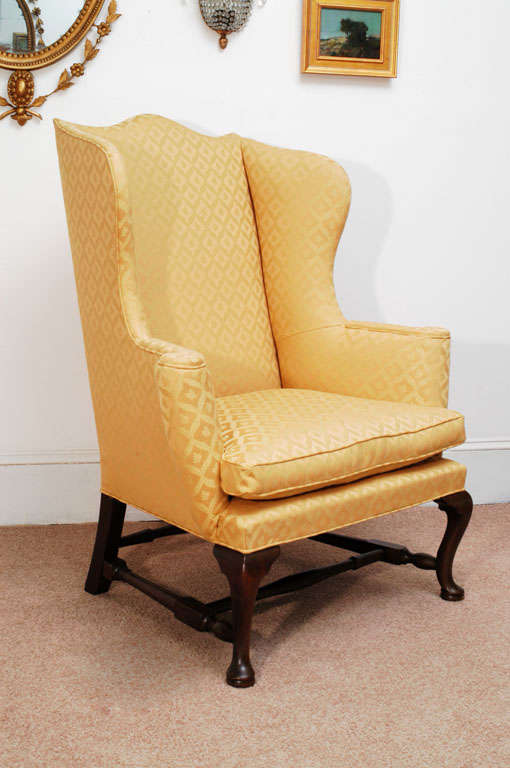 This chair is an exact copy of a circa:1750 New England wing chair, yet is a very comfortable chair you could sit in for hours. The original is in the collection of Colonial Williamsburg. Hand-made reproductions were produced by Kittinger as item