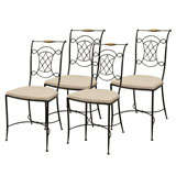 Four Wrought Iron and Upholstered Side Chairs.