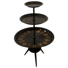 A Piero Fornasetti Three Tiered Display Stand.