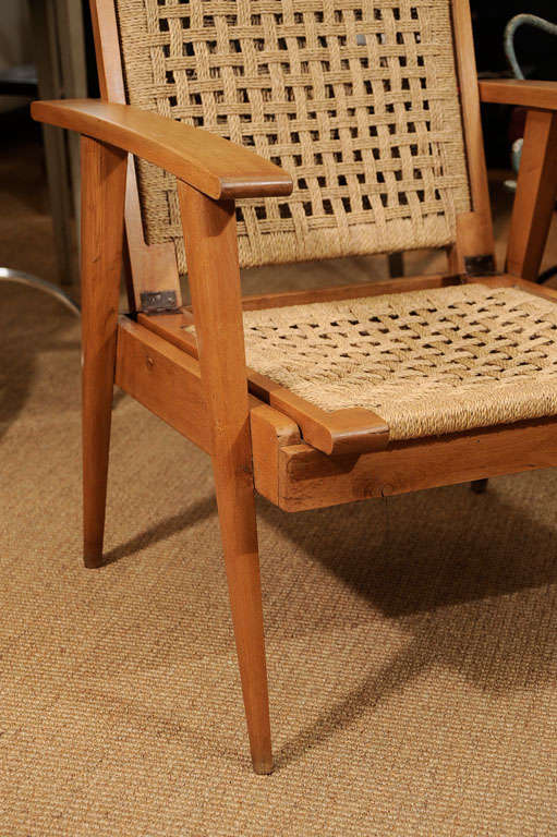 Pair of oak arm chairs with woven cord seats