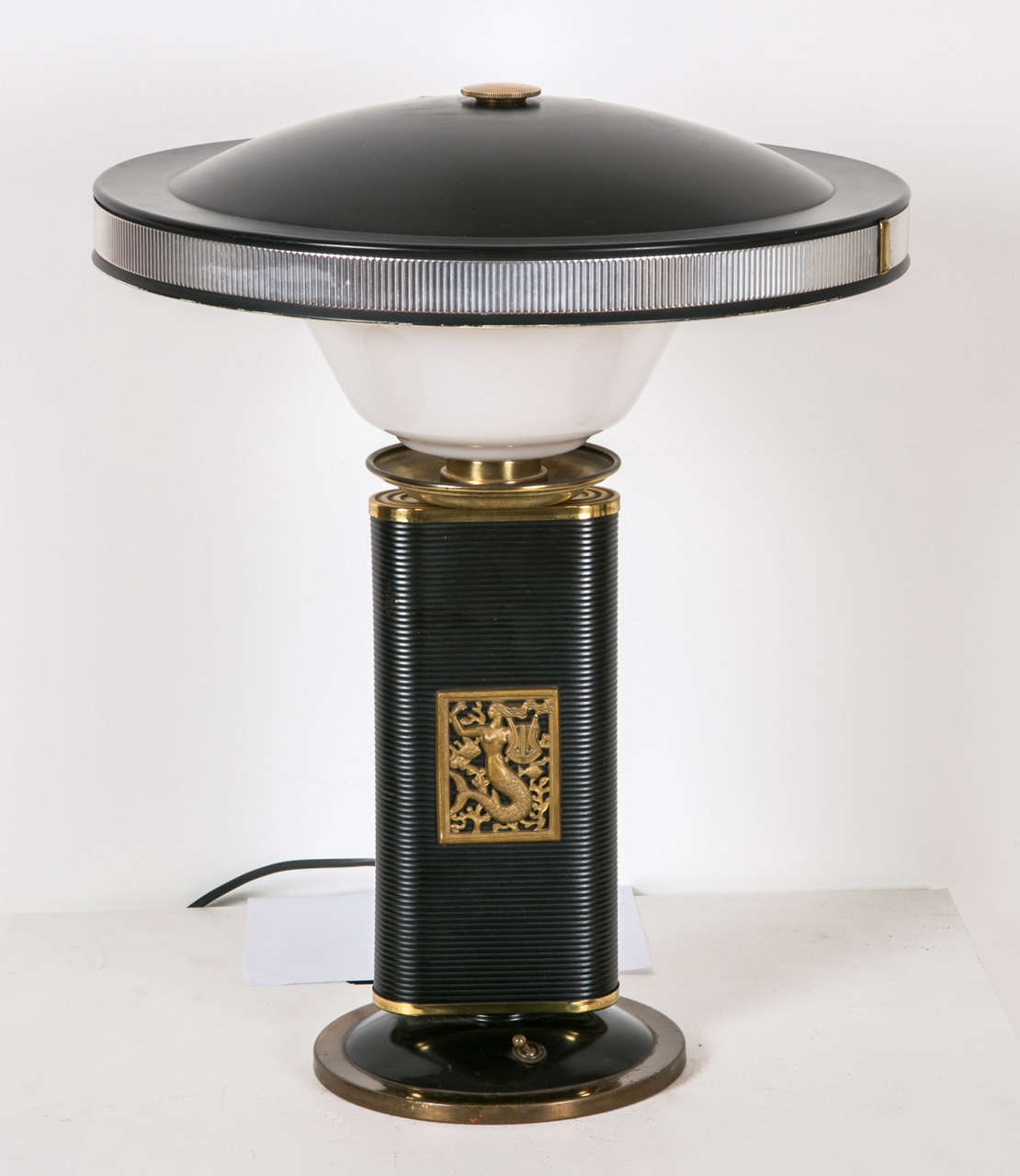 Exceptionally French table lamp 'Sirene-Eileen Gray' edited by Jumo.
The mermaid on the shaft of the lamp can be recognized and is directly inspired by the 'Mermaid Chair' emblematic of Eileen Gray's work. 
Electrical wiring to the European