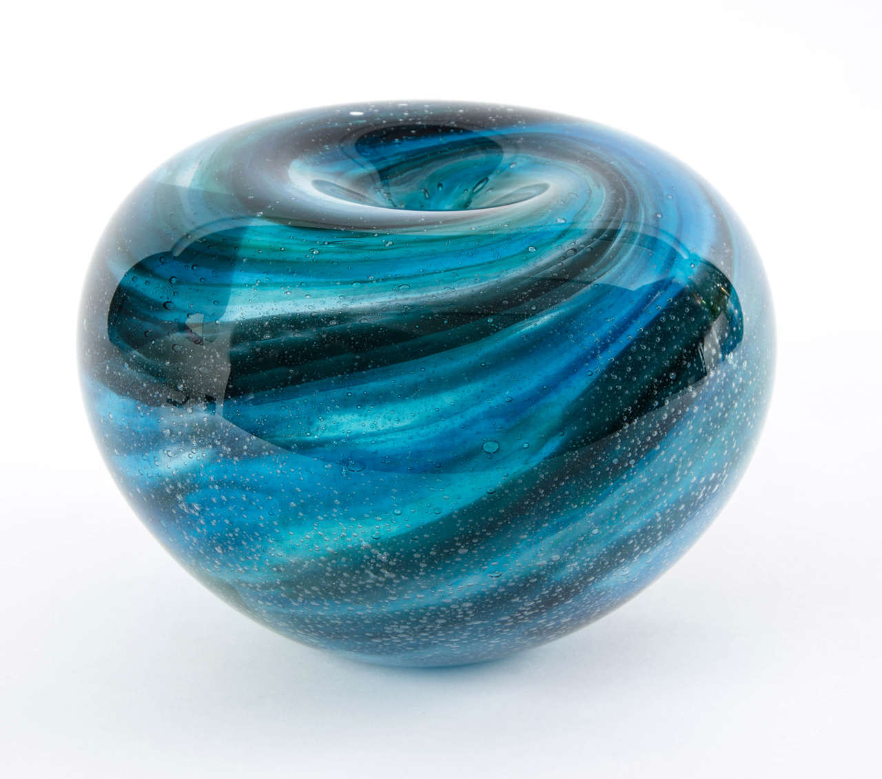Heavy blown glass sculpture with multi layers of colors.