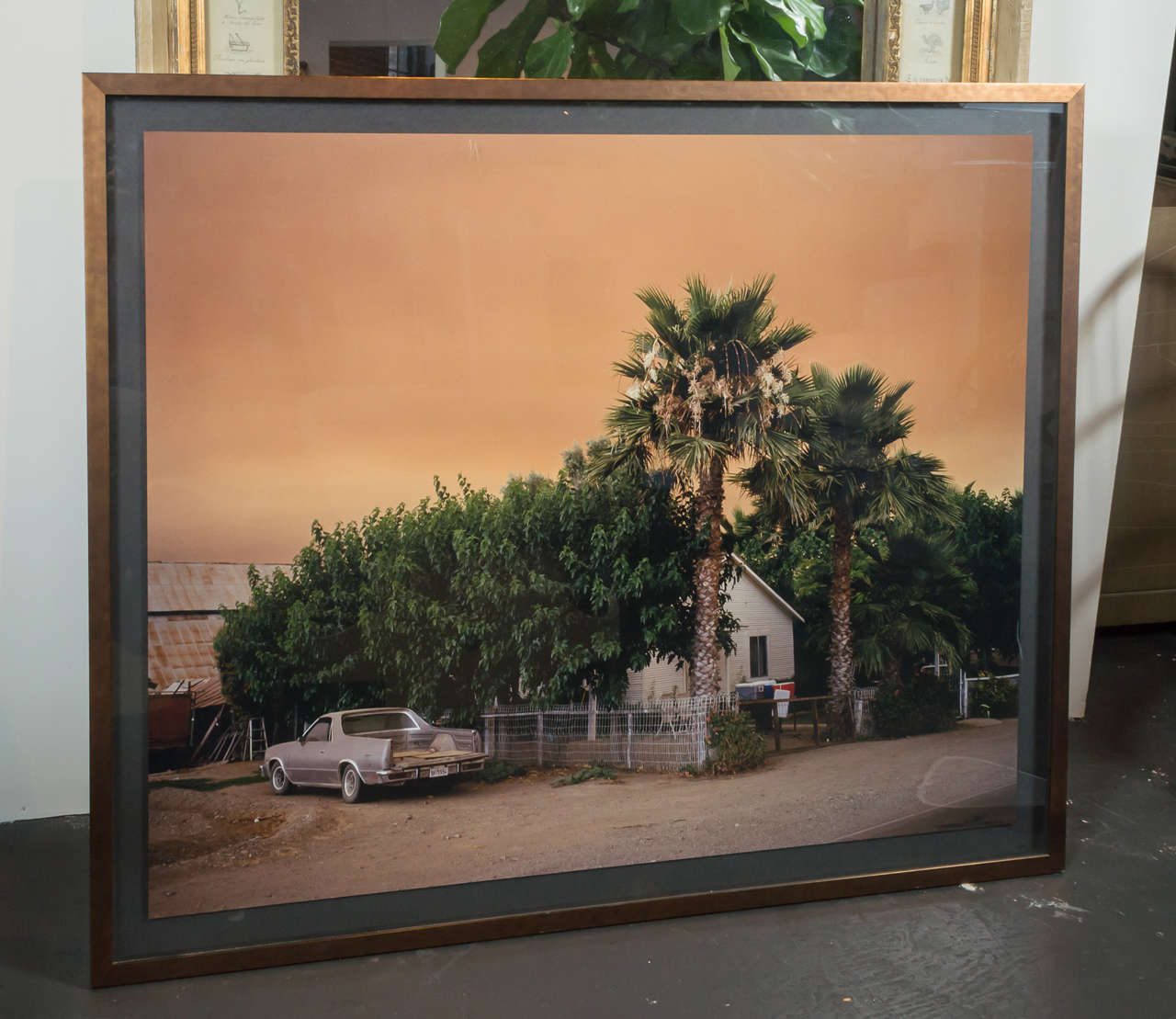 Large Grant Ernhart Photograph.  Not a sunset, it's actually a photo of a fire happening at a neighboring house.  Years later this same house shown in photo burned down and Grant took the same photo, but of the burnt remains.

Grant Ernhart