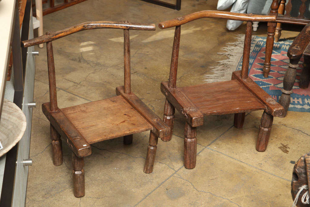 Hand carved and crafted Baule chair from the Ivory Coast of Africa.  Low, simple and unique stool, side table, platform, or stand. One chair still available.