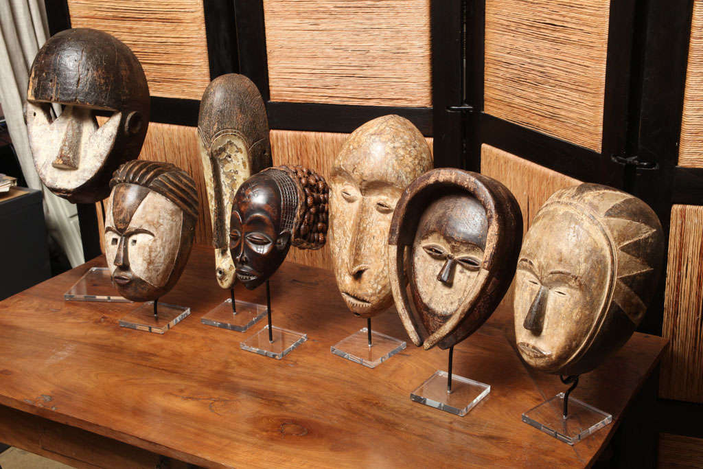 A selection of African masks, representing the traditional styles of various nations and cultural groups including Fang, Kwele, Chokwe, Lega, Vuvi, and Igbo.  Onluy Fang, Kwele and Chokwe still available. Sold separately.  Price and size of Fang