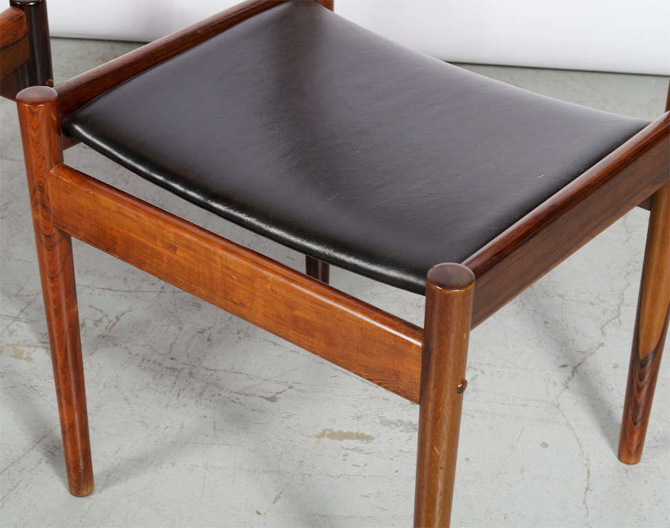 Two chairs model PJ 3-2 with frames of rosewood. Seats upholstered in black leather. Manufactured by P. Jeppesen.