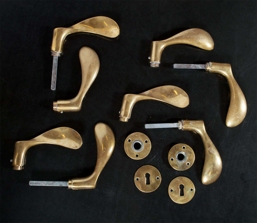 Arne Jacobsen solid brass door handles and hardware. Four sets of door handles and one spare handle. Designed for SAS Hotel, Copenhagen.
