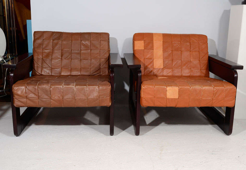 Pair of vintage rosewood armchairs with original buttery soft patchwork leather upholstery. Backs are finished in suede. Part of a full living room suite by Percival Lafer (sofa, two armchairs, coffee table and side table)-- please inquire for