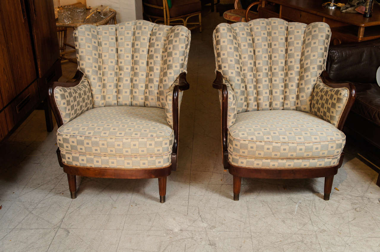 The mahogany frames with channeled upholstery backs