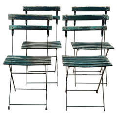 A Set of Four Retro French Bistro Folding Chairs