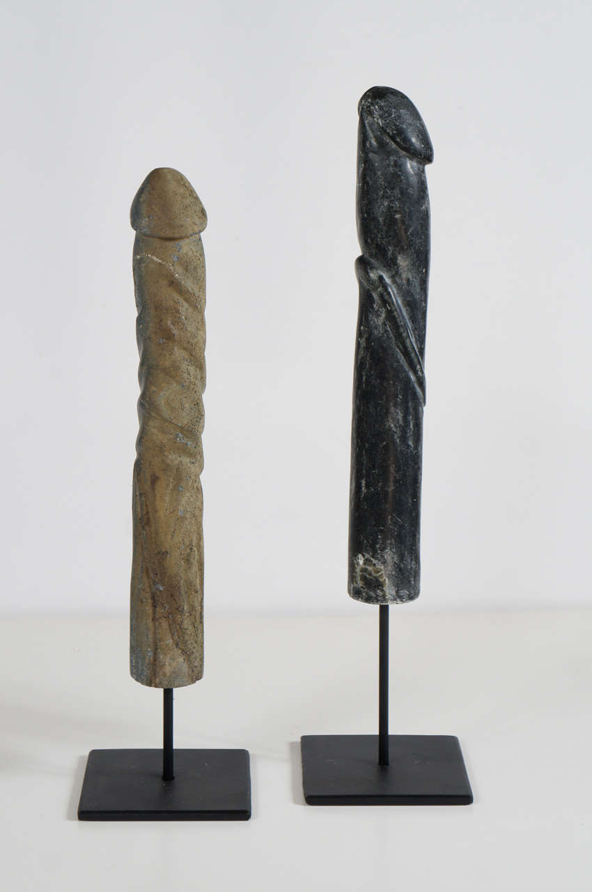 These sculptures carved from native Virginia stone are made in honor of phallic wood sculptures used in African tribes as fetish figures to venerate in women's communal huts. Made in the late 1980's by an African american outsider artist one is