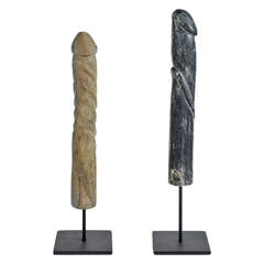 A Set of Carved Stone Penis Sculptures on Iron Stands