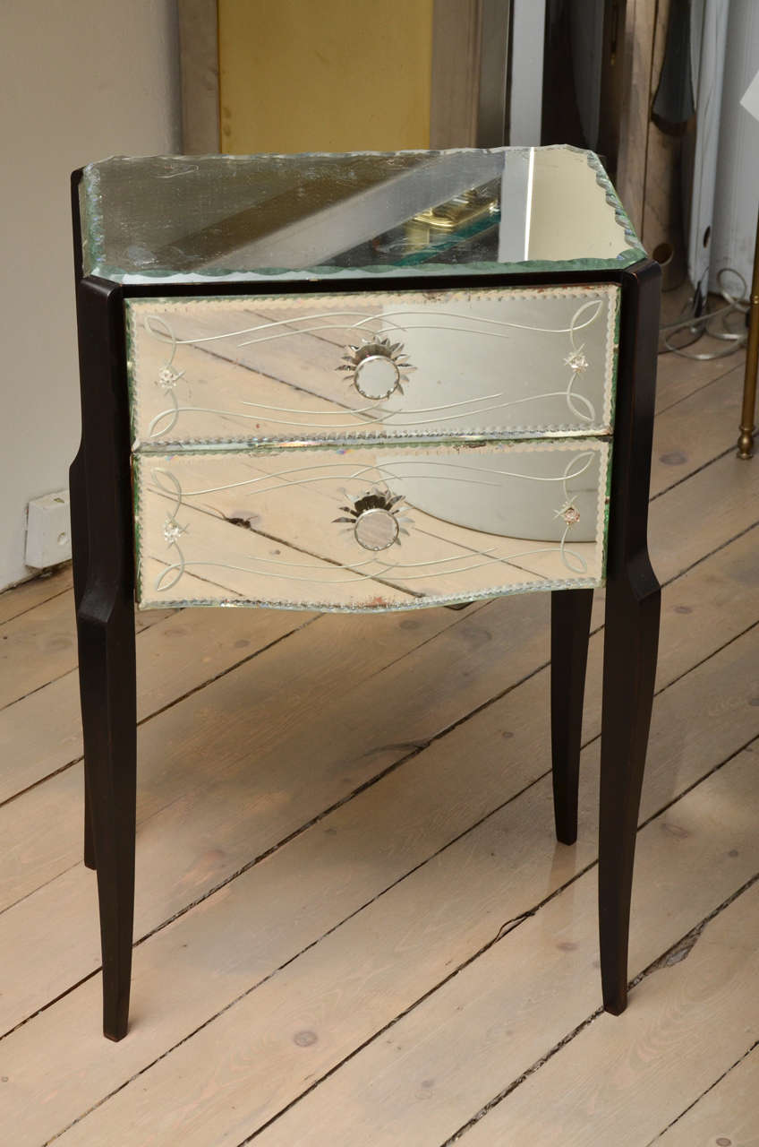 Pair of mirrored 2-drawer night stands with etching on yhe glass to add an accent!