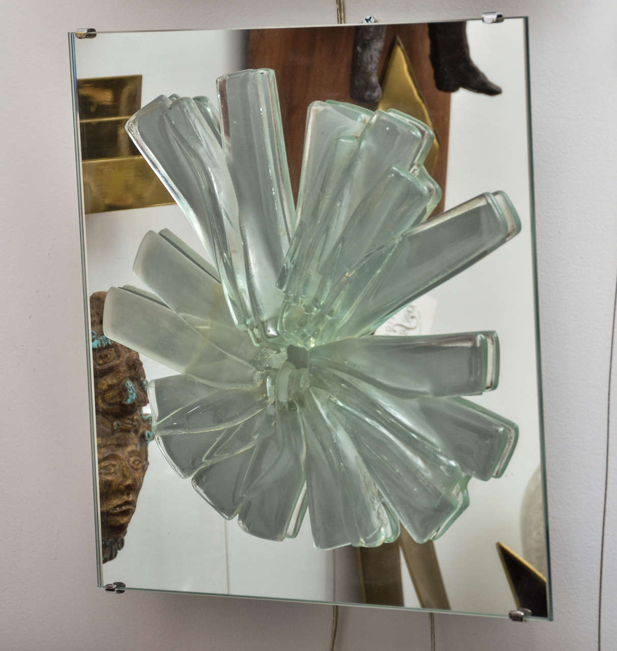 Pair of mirrored and green glass sculptural wall sconces. Wired for two standard bulbs.