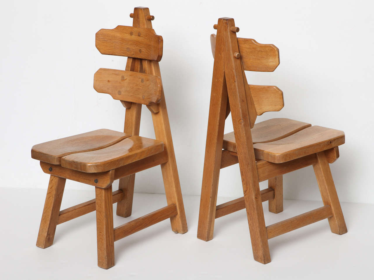 Set of four unusual mid-century side chairs in solid white oak.
