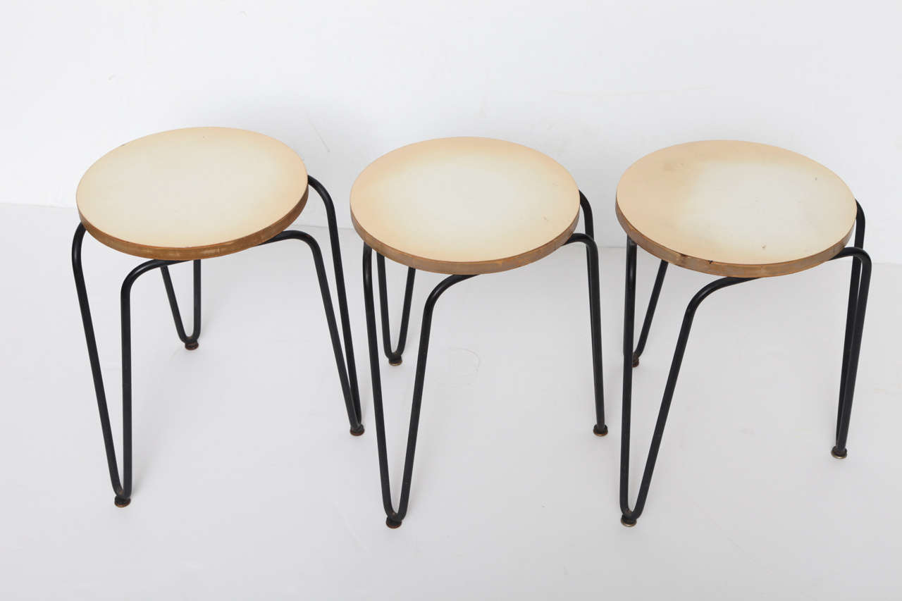 Set of four stools in laminate with enameled iron legs by Florence Knoll 

Measure: Diameter of top 13