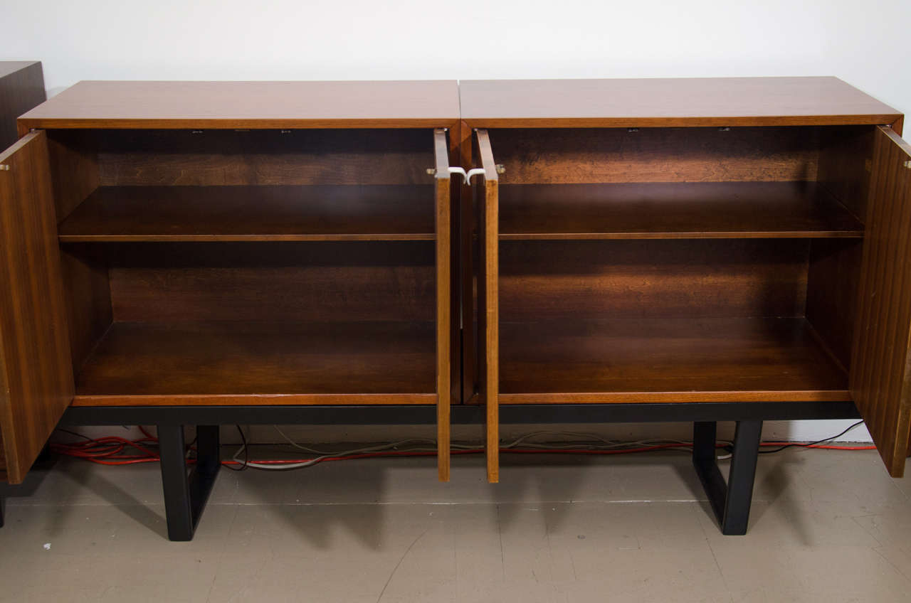 American Pair of George Nelson cabinets on black bench, mfg. Herman Miller