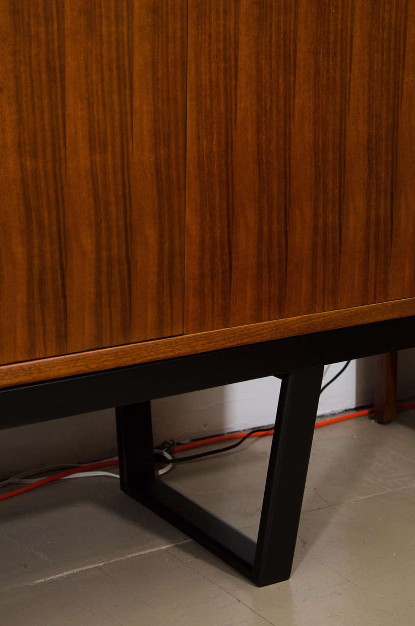 Mahogany Pair of George Nelson cabinets on black bench, mfg. Herman Miller