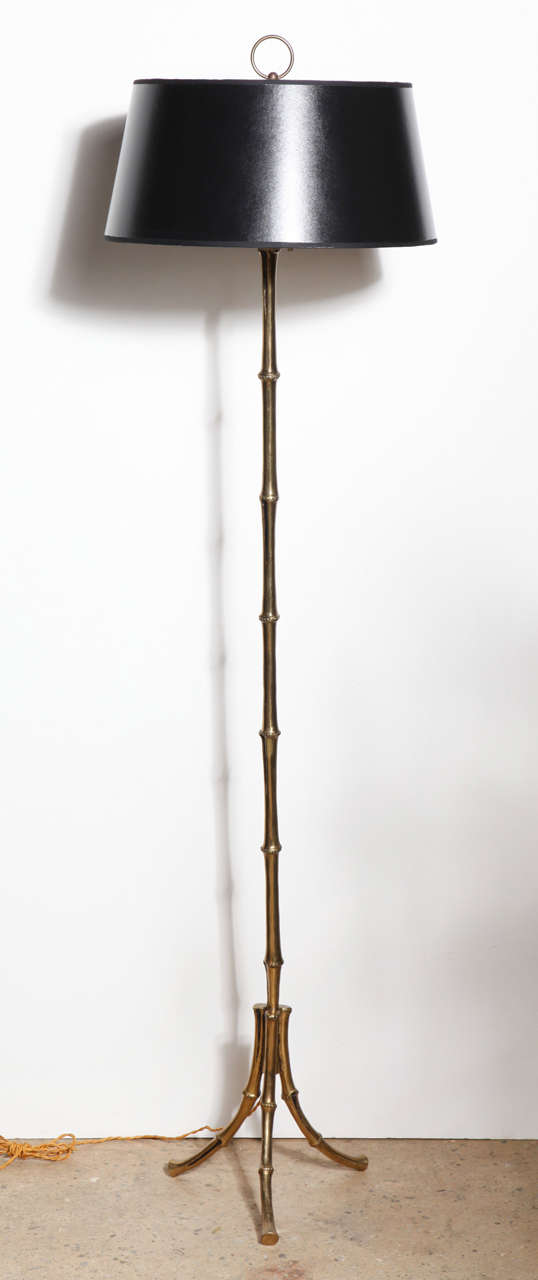 Tall French Mid Century Maison Baguès Faux Bamboo Brass Tripod Reading Floor Lamp. Featuring a Black Shade. With ring finial.  Classic. Versatile. Living. Bedside. Library. Study. Rewired with braided cloth cord