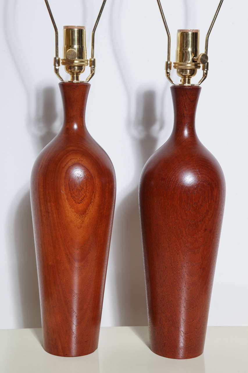 Slender Pair of Danish Modern ESA Denmark solid Turned Teak  Bedside Lamps, Desk Lamps. Featuring rounded bowling pin bottle form. 18