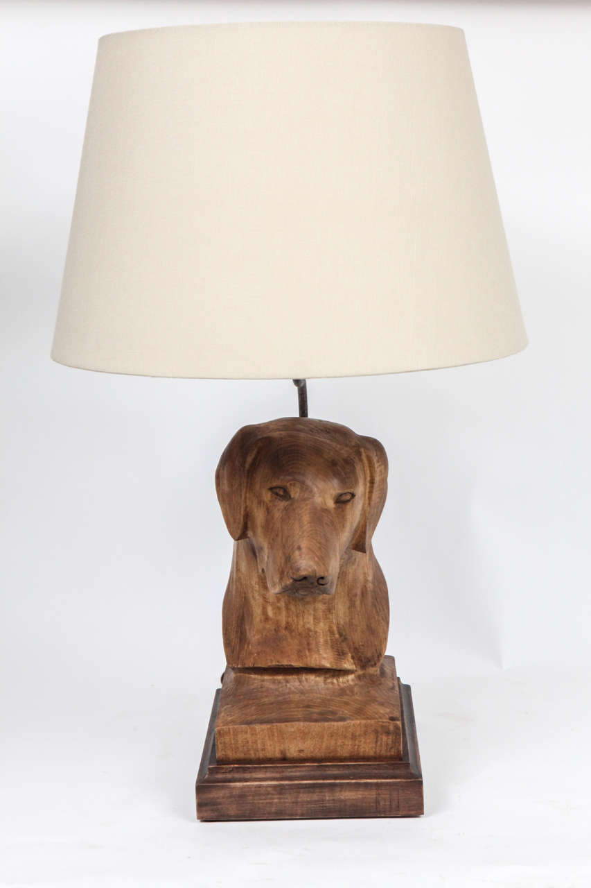 These charming, limited edition dog lamps are hand-carved replicas of a sculpture of a Labrador done in three finishes. The lamps are recently rewired and ready for use. Custom linen lampshades are included.
Measurements of shade:
Height 11 5/8