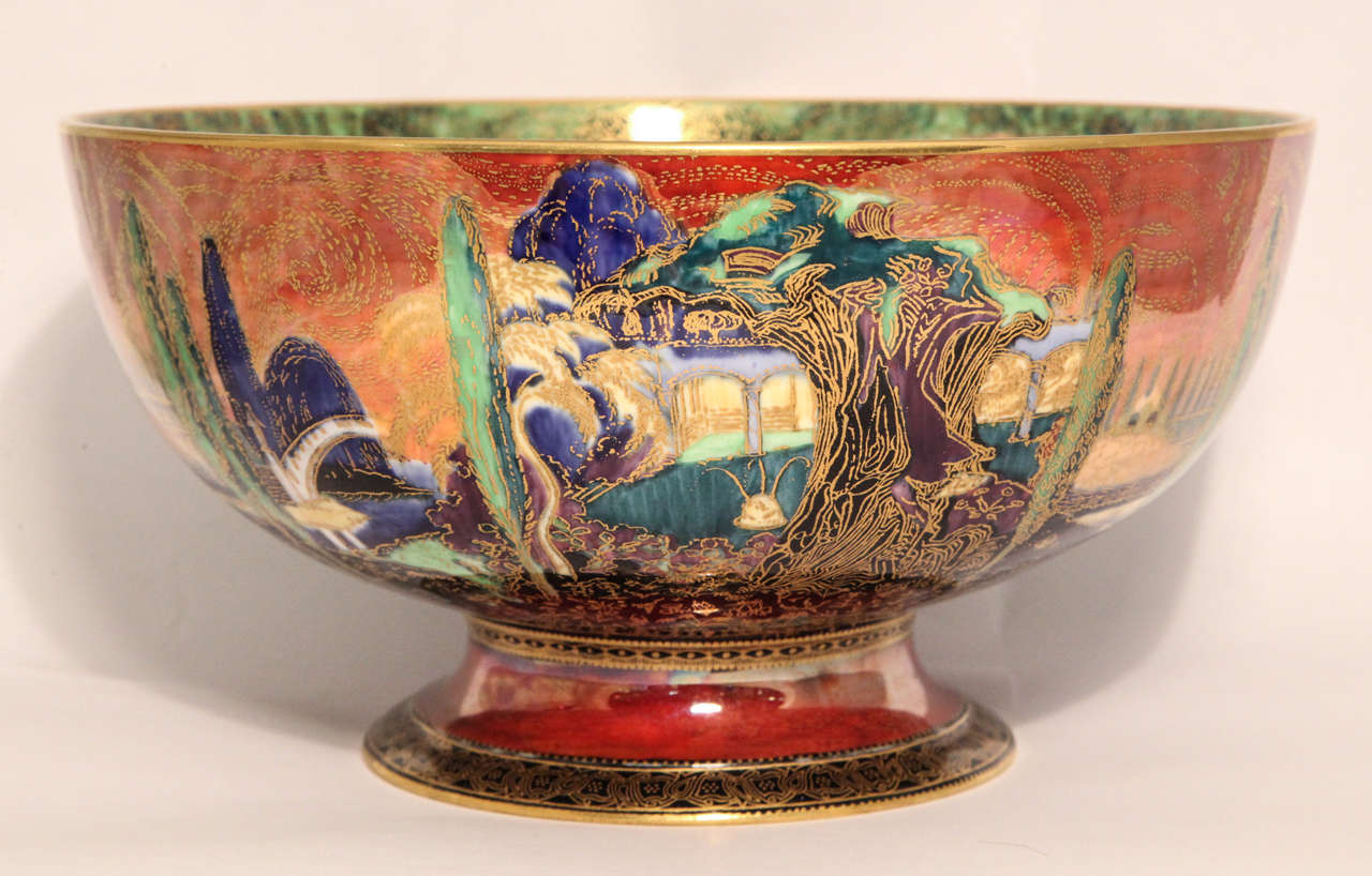 A rare Wedgwood Fairyland Lustre footed bowl with Poplars pattern on the outside and Woodland Elves Variation IV on the inside, both on a flame ground, the inside initialed 