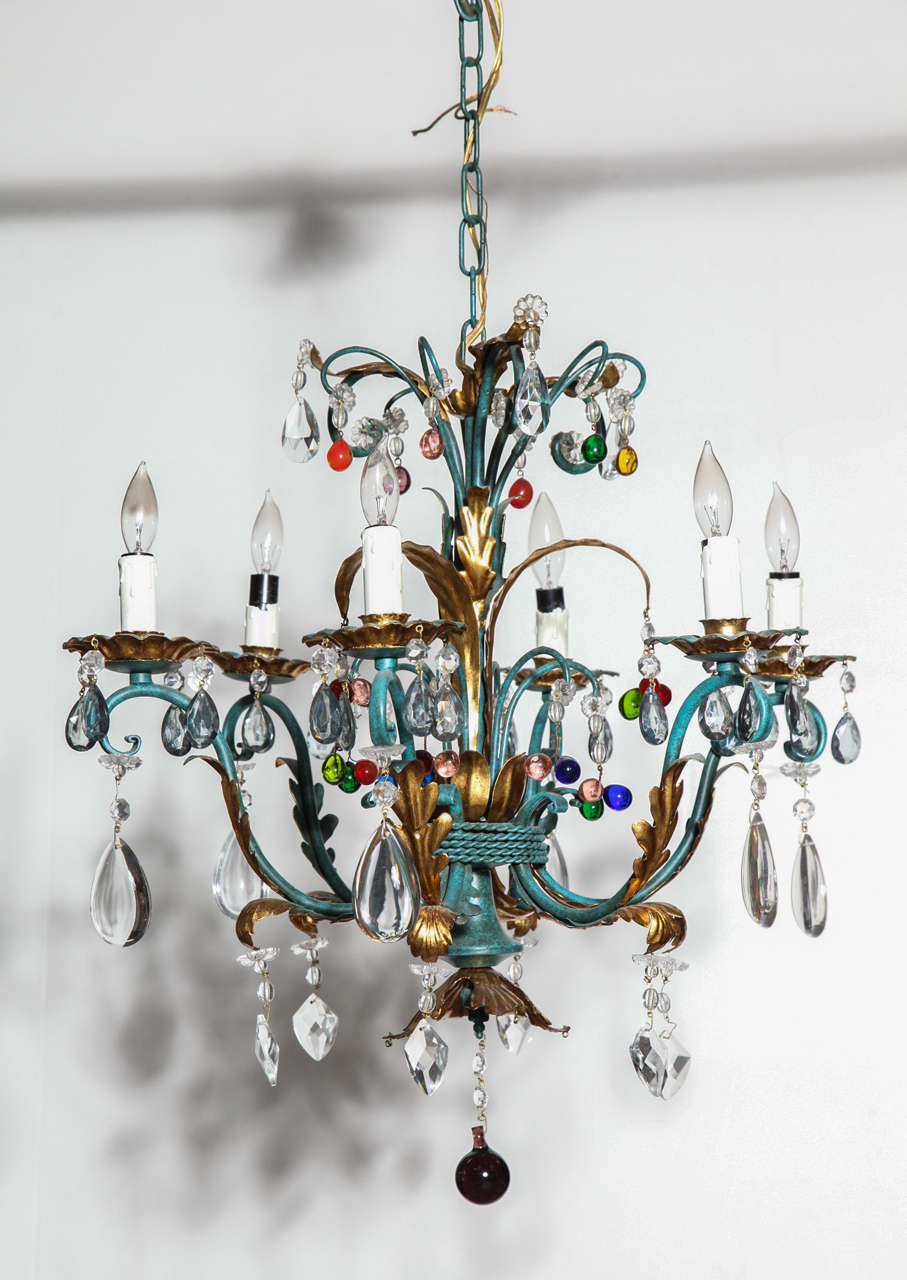 Stylish five-light chandelier with green patina and gilt leaf detail. Clusters of assorted colorful and clear crystals add a playful quality. Wired for USA.