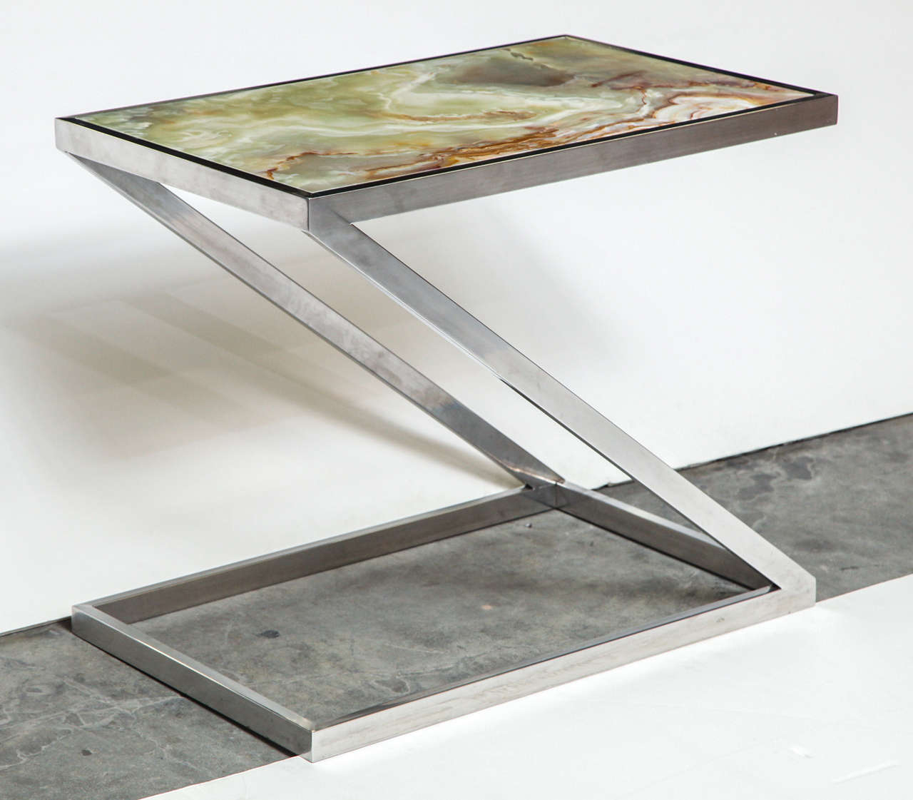 Phenomenal Italian side table with an onyx top and chrome base, circa 1970.