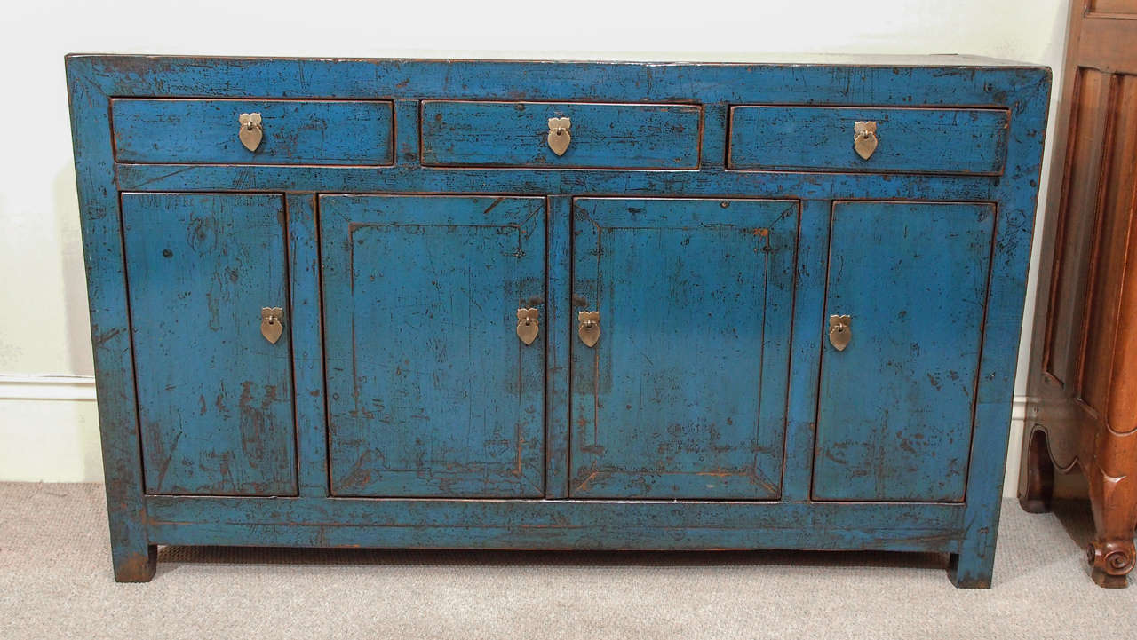 Antique Chinese deep blue lacquer sideboard with three drawers over four doors. 
Dongbei province.