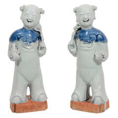 A Pair of 18th Century Chinese Porcelain Laughing Boys