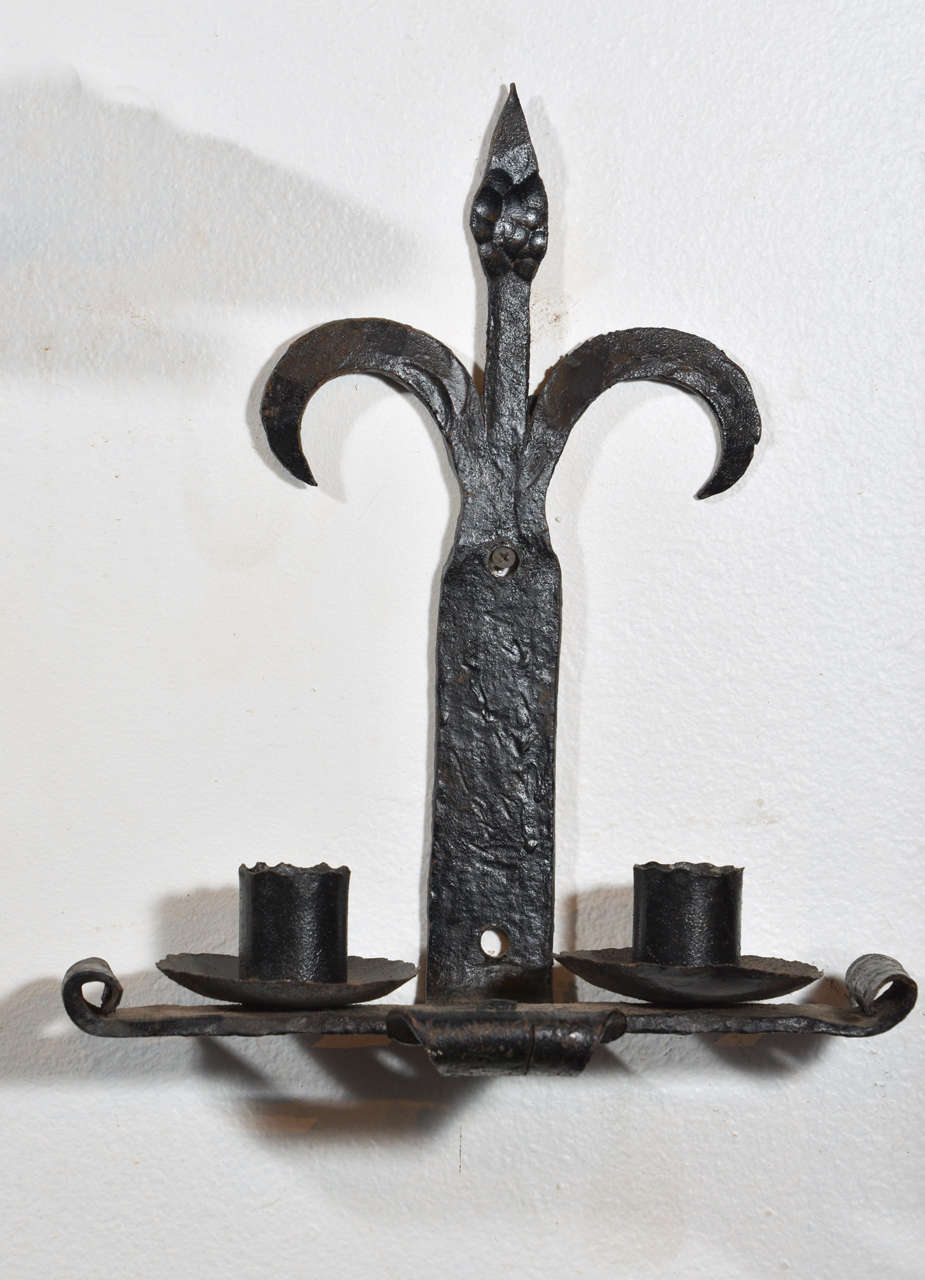 Pair of Antique Hand Forged Iron Fleur de Lys Sconces from France In Good Condition In Dallas, TX