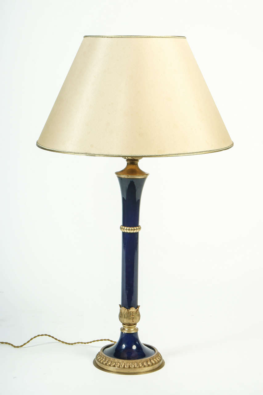 Lamp base made of blue porcelain adorned with bronze. New wiring with fabric cord.