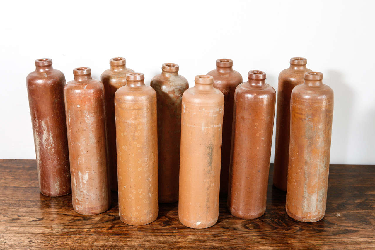 Rustic ceramic bottles/vases. 15 available. Sold individually.