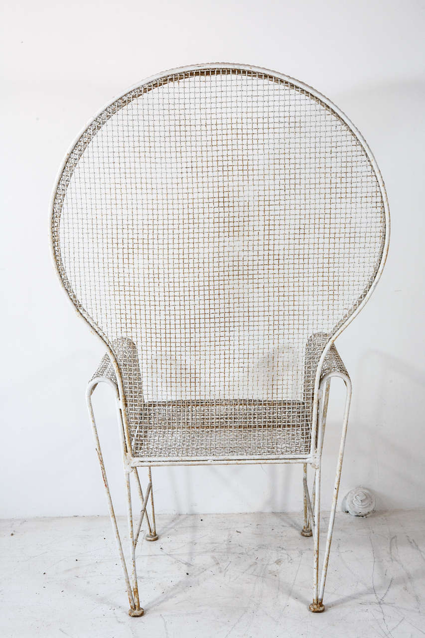 Beautiful white wire garden chairs with curved arms and large hooded back.