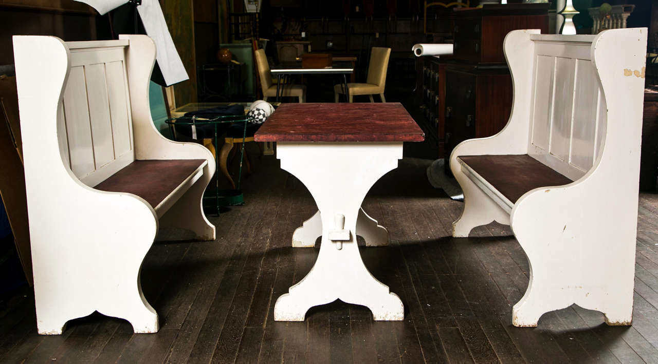 Charming early 20th century dining nook with nice wood details. tabletop is currently covered with an oil cloth type covering. Benches are 52.25