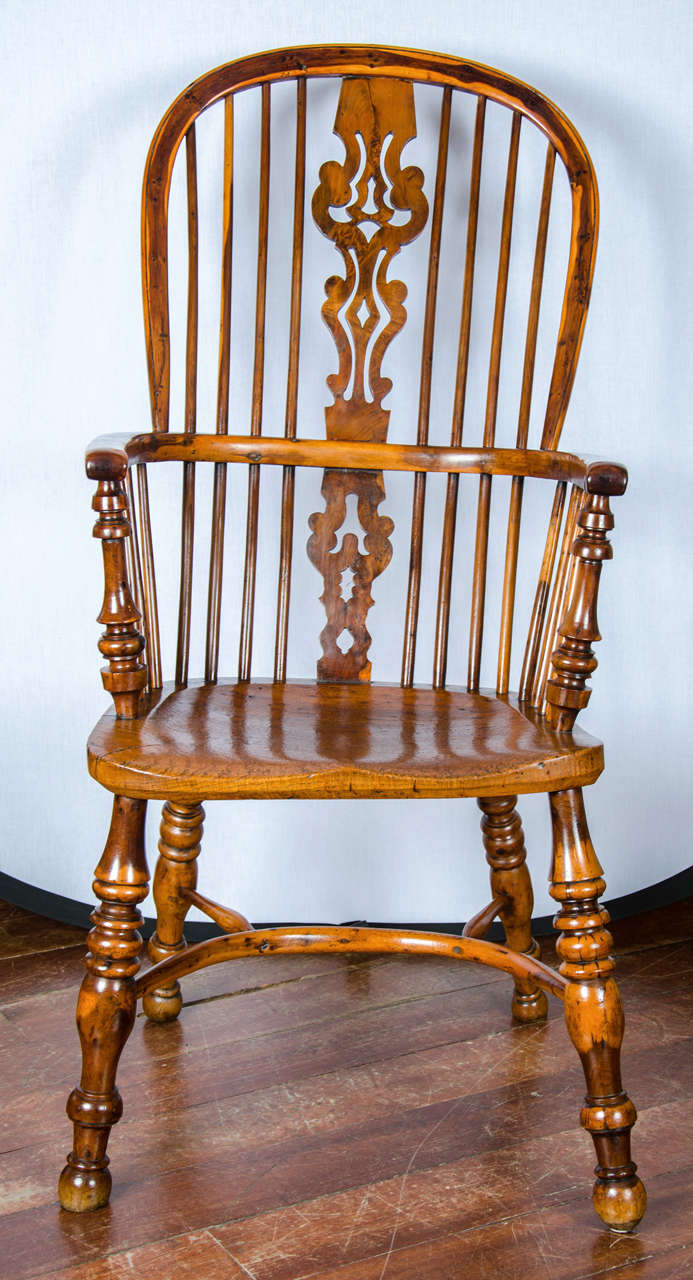 A fine and rare high splat back Windsor armchair in yew with elm seat and ash back legs.
Of particular note is the careful choice and use of thinner parts of the yew tree to exhibit and highlight both the sap and hard wood giving a striking