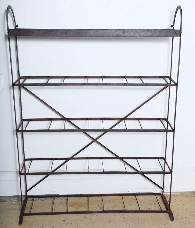Large Forged and Riveted French Darkened Iron Bread Rack from the Late 19th Century.  Featuring a taut open Five shelf framework, original Dark Iron patina with rounded top arching details. Each shelf 11.5 inches deep. 13 inches high between each